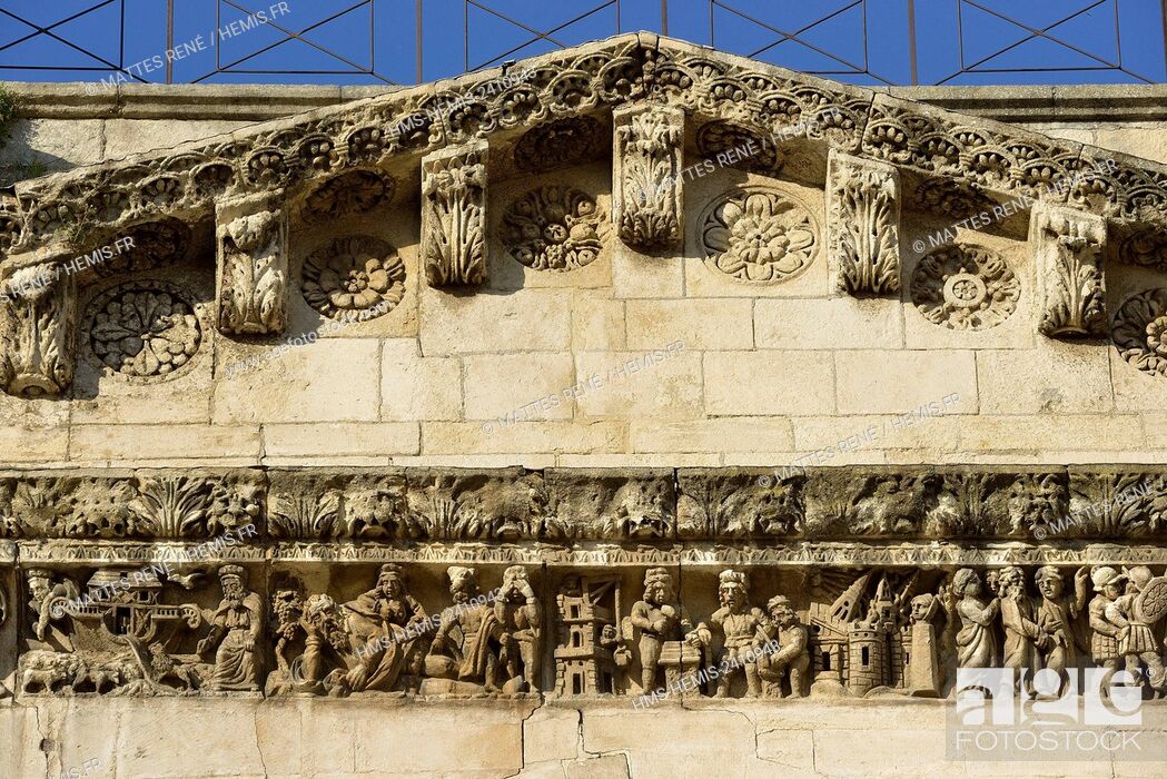 Stock Photo: France, Gard, Nimes, detail of the facade of Notre Dame et Saint Castor Cathedral, Sculptured frieze.