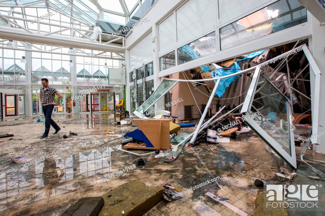Stock Photo: The promenade of a shopping mall is covered in wreckage and smashed pieces of glass in Erfurt, Germany, 18 May 2013. A severe thunderstorm with hail.
