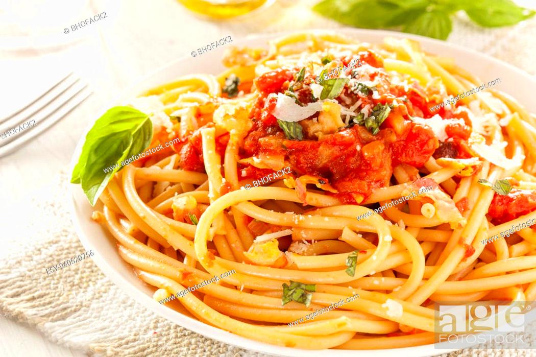 Stock Photo: Homemade Bucatini Amatriciana Pasta with sauce and basil.