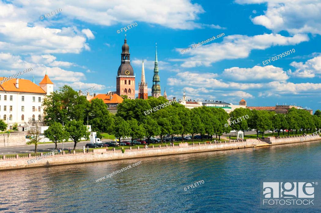 Stock Photo: Towers of Riga and castle seen across river Daugava. Three church towers in the picture are the Riga Dome cathedral, St. Saviour's Church and St.