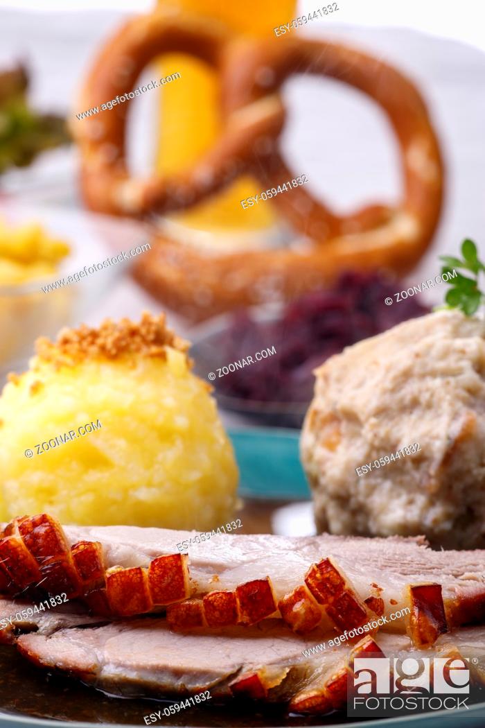 Stock Photo: bavarian roasted pork with dumplings.