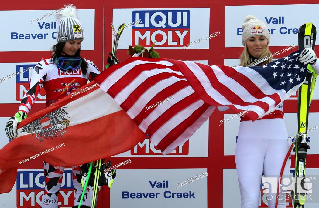 Stock Photo: (L-R) Anna Fenninger of Austria, 1st place, and Lindsey Vonn of the USA, 3rd place, celebrate on the podium during the Flower ceremony after the Ladies Super-G.