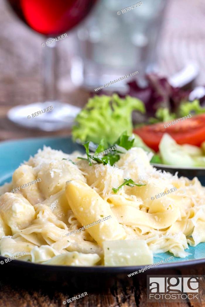 Stock Photo: closeup of white asparagus on pasta.