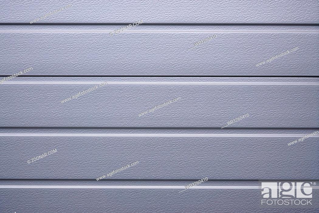 Stock Photo: silver gray metallic shutter or cladding. background texture.