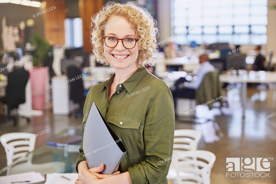 Stock Photo: Portrait smiling businesswoman in office.