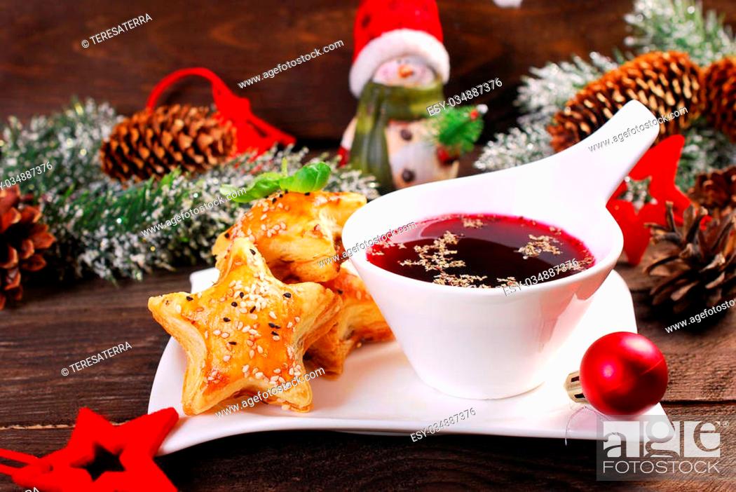 Stock Photo: star shaped puff pastries with mushrooms and cup of red borscht for christmas eve on wooden table.