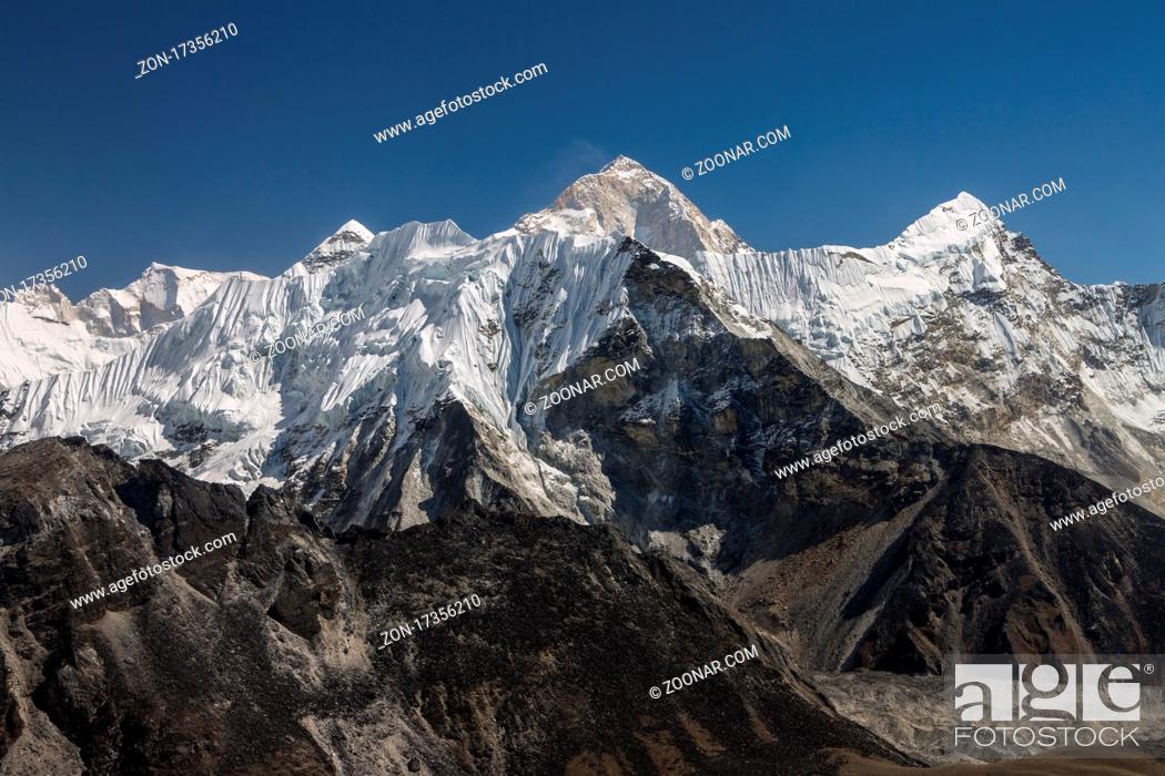 Stock Photo: View from Chukhung Ri (5550m) ? a trekking peak located in the Imja Khola valley?s upper part. Imja Tse (Island Peak, 6189m) ? the popular 6000-metres-plus peak.
