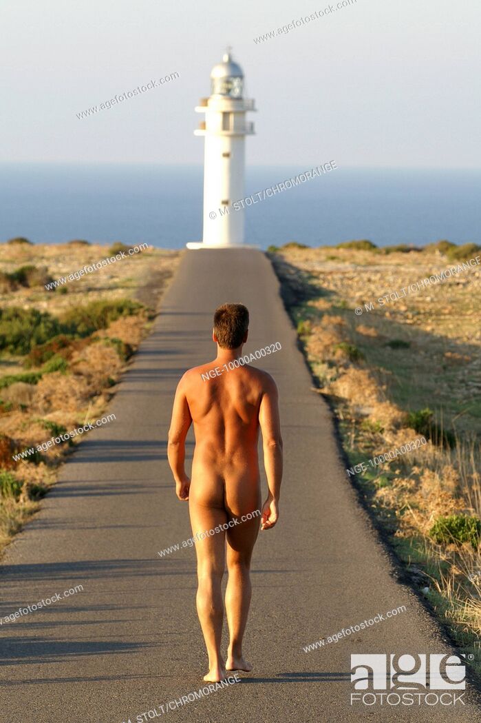 Stock Photo - naked man walking to lighthouse.