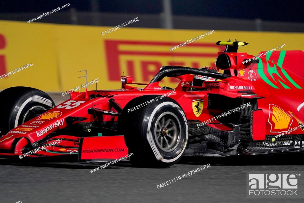 Stock Photo: 19 November 2021, Qatar, Losail: Motorsport: Formula 1, ahead of the Qatar Grand Prix: Spanish driver Carlos Sainz Jr. of Team Ferrari steers his car during the.