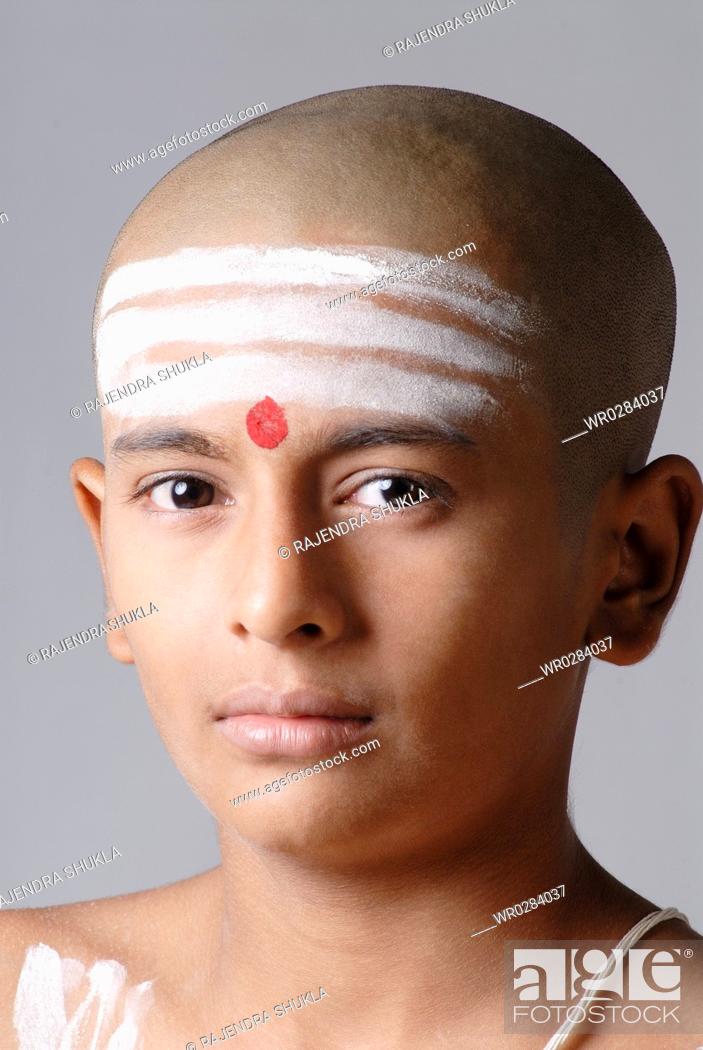Stock Photo: Portrait of South Asian Indian bald boy red tilak on forehead MR719.