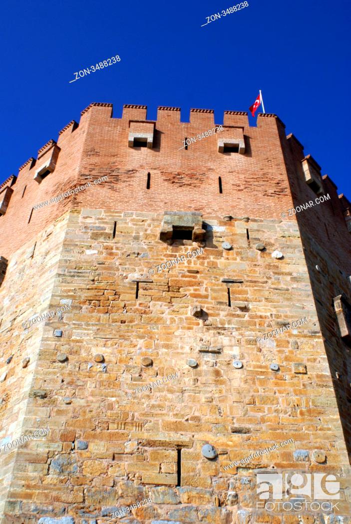 Stock Photo: Red tower and turkish flag in Alanya, Turkey.