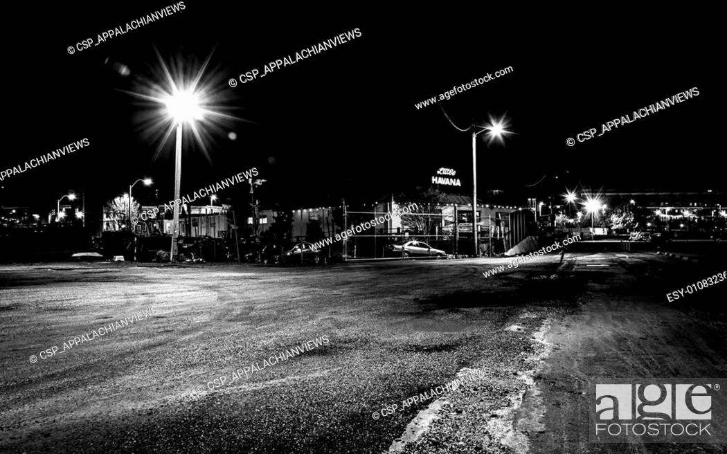 Stock Photo: Empty parking lot and Little Havana Restaurant at night in Baltimore, Maryland.