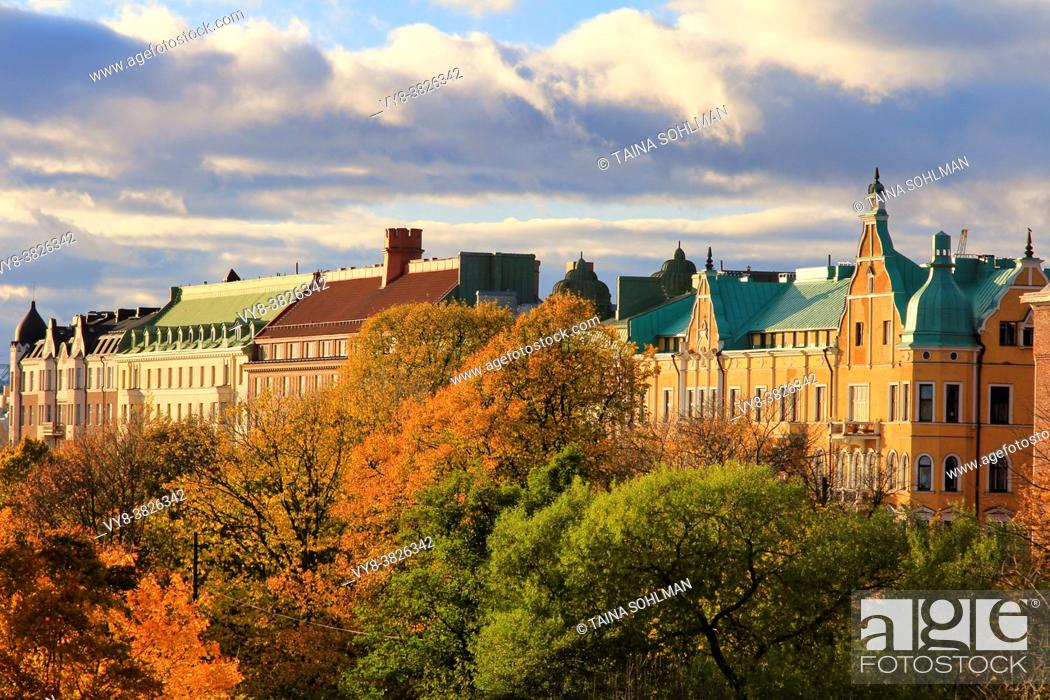 Stock Photo: Treetops and residential houses in central Helsinki on a beautiful day of autumn.