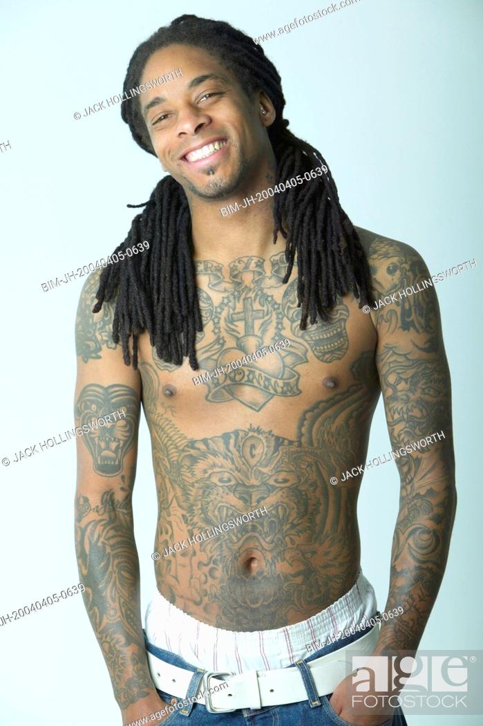 Portrait of man covered with tattoos, Stock Photo, Picture And Royalty Free Image. Pic. BIM-JH-20040405-0639