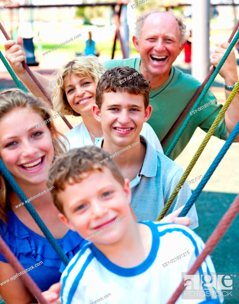 Stock Photo: Close-up shot of a family playing in the playground.