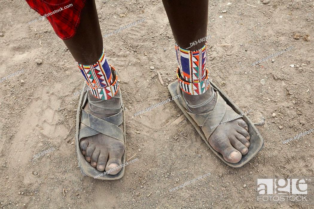 Imagen: Detail of sandals made from car tires and ankle ornaments worn by a Masai warrior, Masai village within the Amboseli National Park. Kenya.