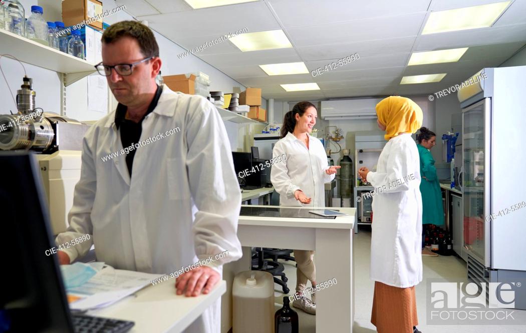 Stock Photo: Scientists talking in laboratory.
