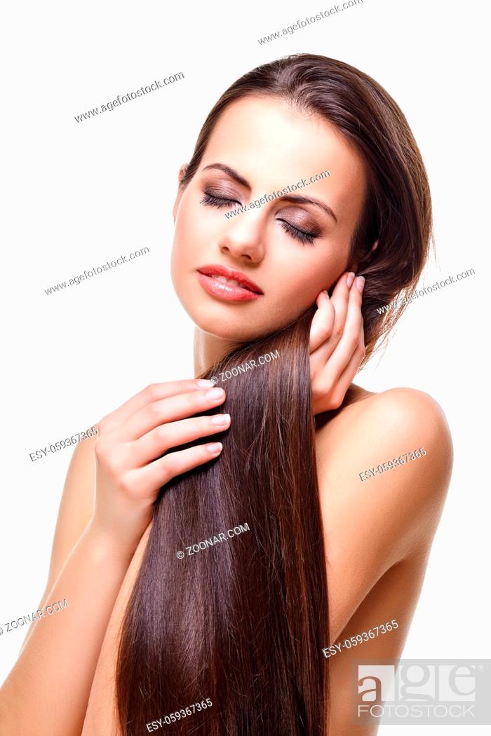 Stock Photo: beautiful young woman with long healthy dark hair. beauty shot isolated on white background. copy space.