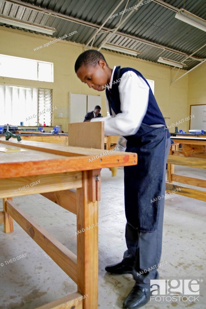 Stock Photo: School boy clamping wood in woodwork classroom, St Mark's School, Mbabane, Hhohho, Kingdom of Swaziland.