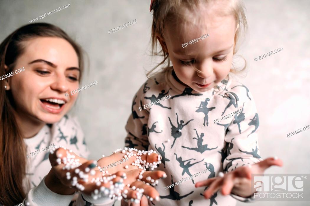 Stock Photo: Happy loving family. Mother and her daughter girl play in the room.