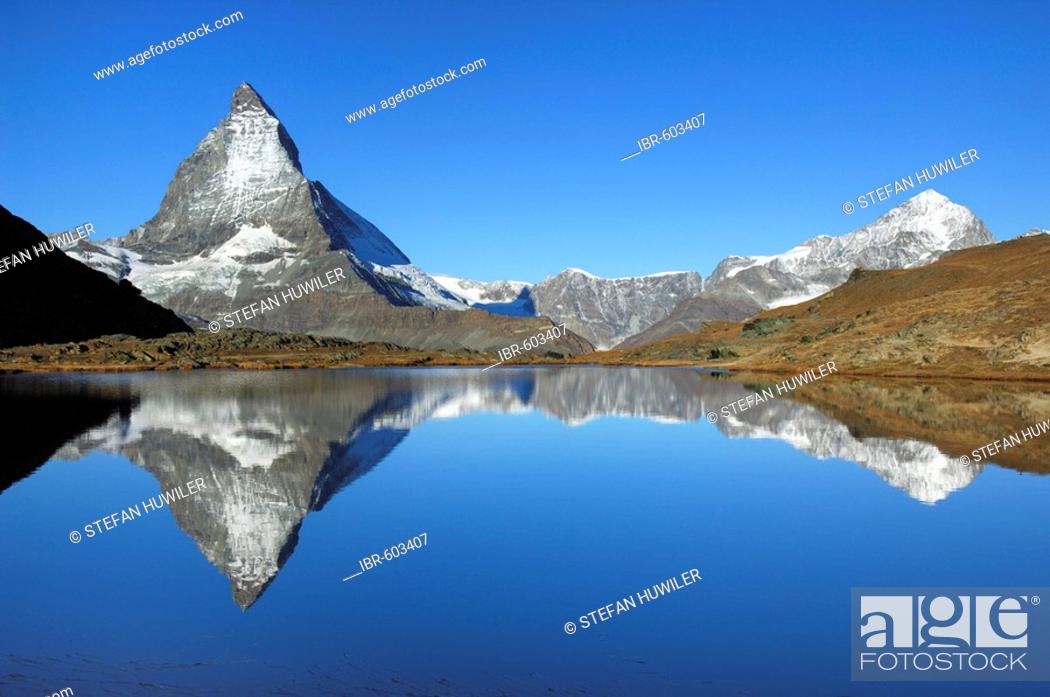 Stock Photo: Matterhorn being reflected in the Riffelsee, Zermatt, Valais, Switzerland.