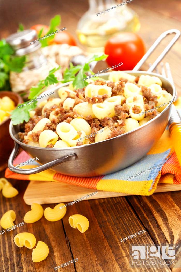 Stock Photo: Pasta with minced meat on the metal pan.