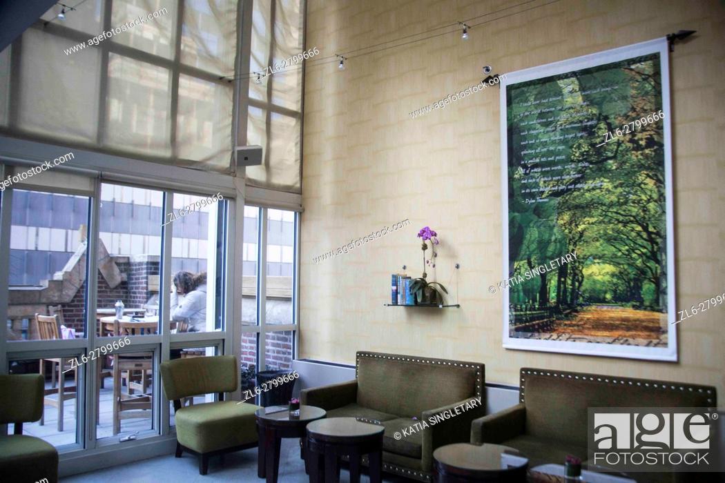 Stock Photo: Inside of Lounge rooftop with a outdoor terrace in a New York City Hotel. The inside lounge has modern furniture and paintings.