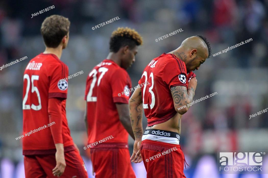 Stock Photo: Munich's Thomas Mueller (L-R), David Alaba and Arturo Vidal react after the UEFA Champions League semi final second leg soccer match between Bayern Munich and.