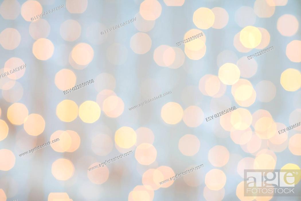 Stock Photo: holidays, party and celebration concept - blurred golden lights background.