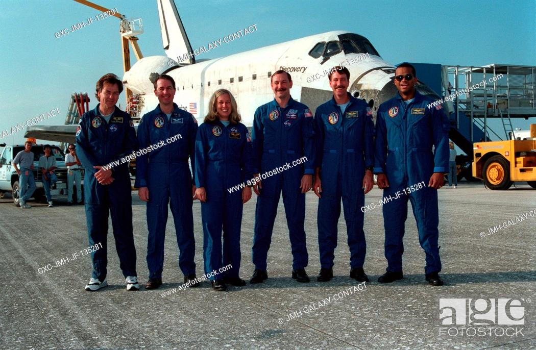 Stock Photo: Following the landing of the Space Shuttle Discovery on runway 33 at the Kennedy Space Center (KSC), the six member crew poses for a final crew portrait.