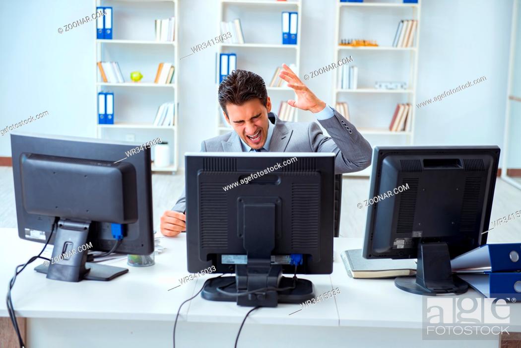 Photo de stock: Businessman sitting in front of many screens.