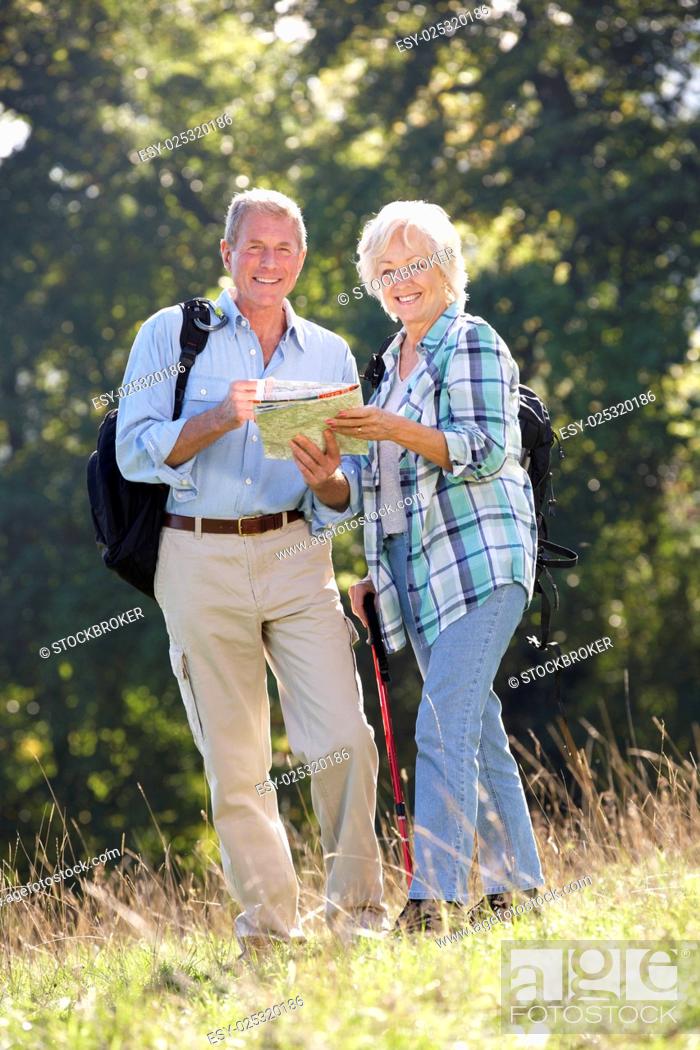 Stock Photo: Senior couple on country walk.