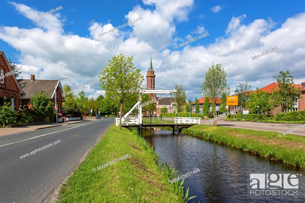 Stock Photo: Westrhauderfehnkanal (canal), Bascule bridge, Evangelical-Lutheran church of hope, Westrhauderfehn, Rhauderfehn, Overledingerland, Eastern Frisia, Lower Saxony.