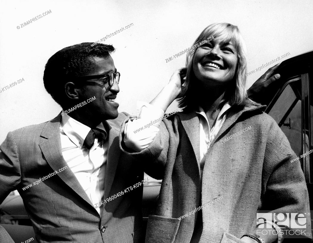 Stock Photo: Apr. 6, 1960 - London, England, U.K. - Singer SAMMY DAVIS JR. seen here in London greeting Swedish actress MAY BRITT as she arrived from Hollywood.