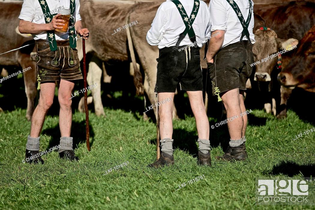 Stock Photo: Men wearing traditional clothes having a break, Viehscheid, Allgau, Bavaria, Germany.