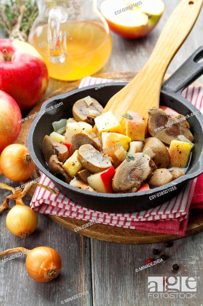 Stock Photo: Kidneys beef in cider with apples on the table.