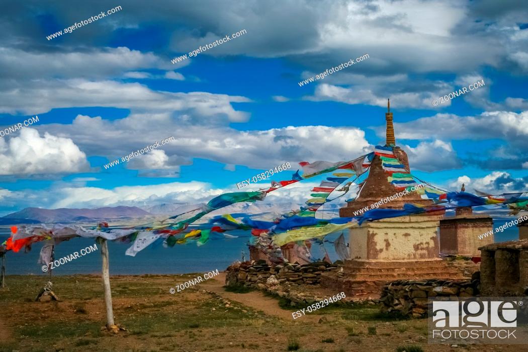 Stock Photo: Small old Tibetan monastery and praying mills on a hill above holy Lake Manasarovar, Tibet.