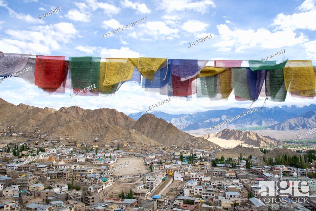 Stock Photo: view at Leh with prayer flags, Ladakh, India from old Palace at top of hill.
