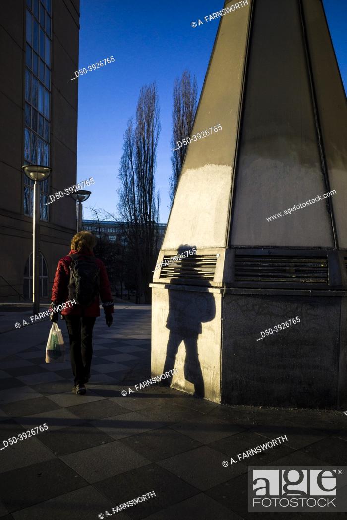 Photo de stock: Stockholm, Sweden A person and their shadow in the winter sun at Medborgaplatsen on Sodermalm.