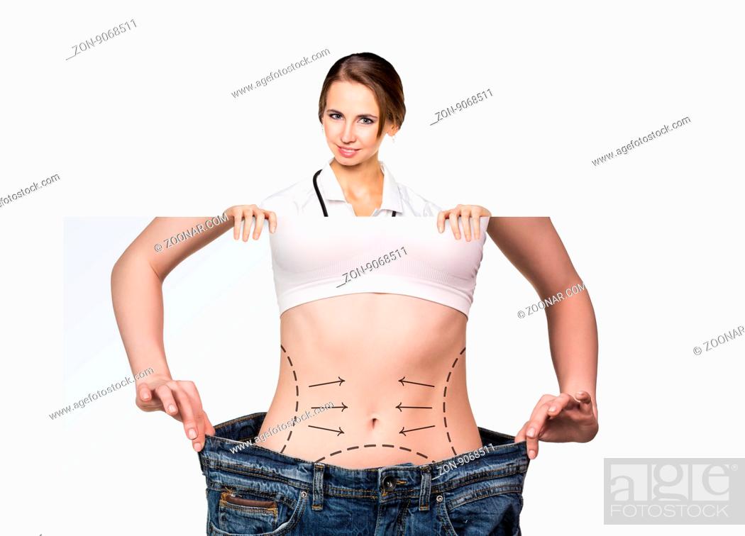 Stock Photo: Female doctor holds placard with woman battocks and correction lines on them. Plastic surgery concept.