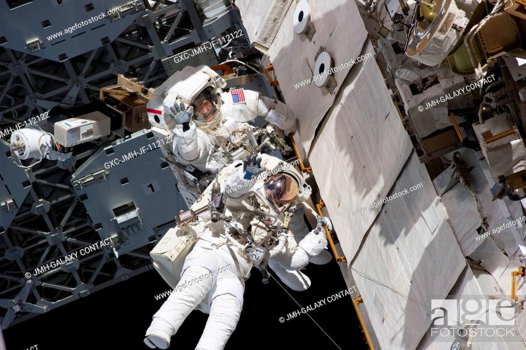 Stock Photo: NASA astronauts Steve Bowen and Alvin Drew, both STS-133 mission specialists, participate in the mission's first session of extravehicular activity (EVA) as.