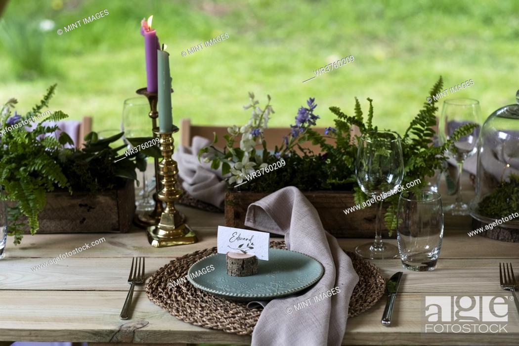 Stock Photo: High angle view of rustic place setting for a woodland naming ceremony.