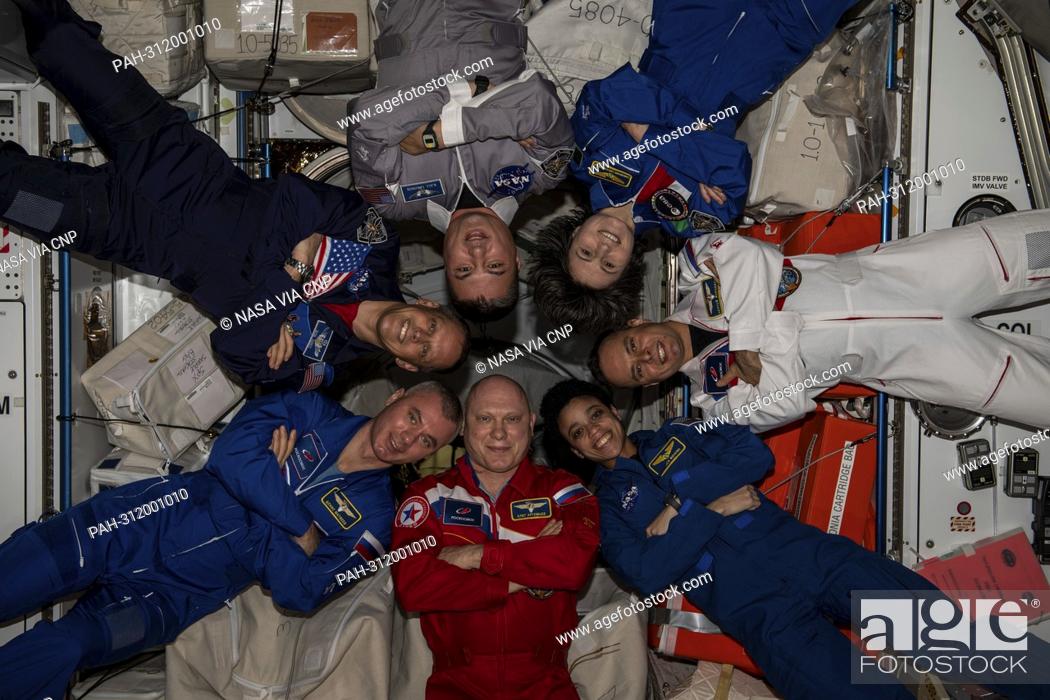 Stock Photo: The seven-member Expedition 67 crew poses for a portrait inside the International Space Station's Harmony module on August 18, 2022.