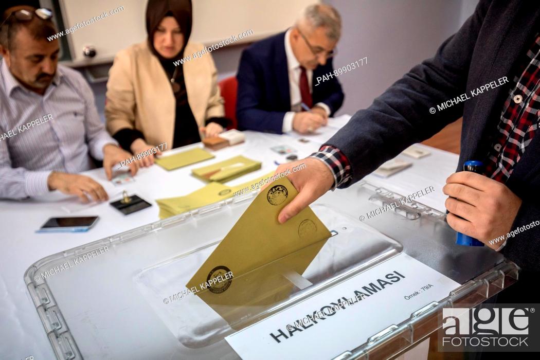 Stock Photo: A man casts his vote at a polling station in Istambul, Turkey, 16 April 2017. Turkish citizens are voting on a constitutional amendment towards the introduction.