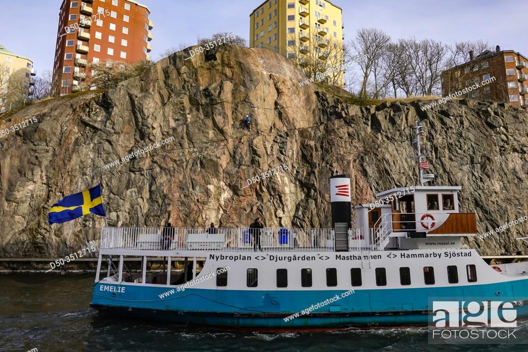 Stock Photo: Stockholm, Sweden A passenger ferry and a rock climber.
