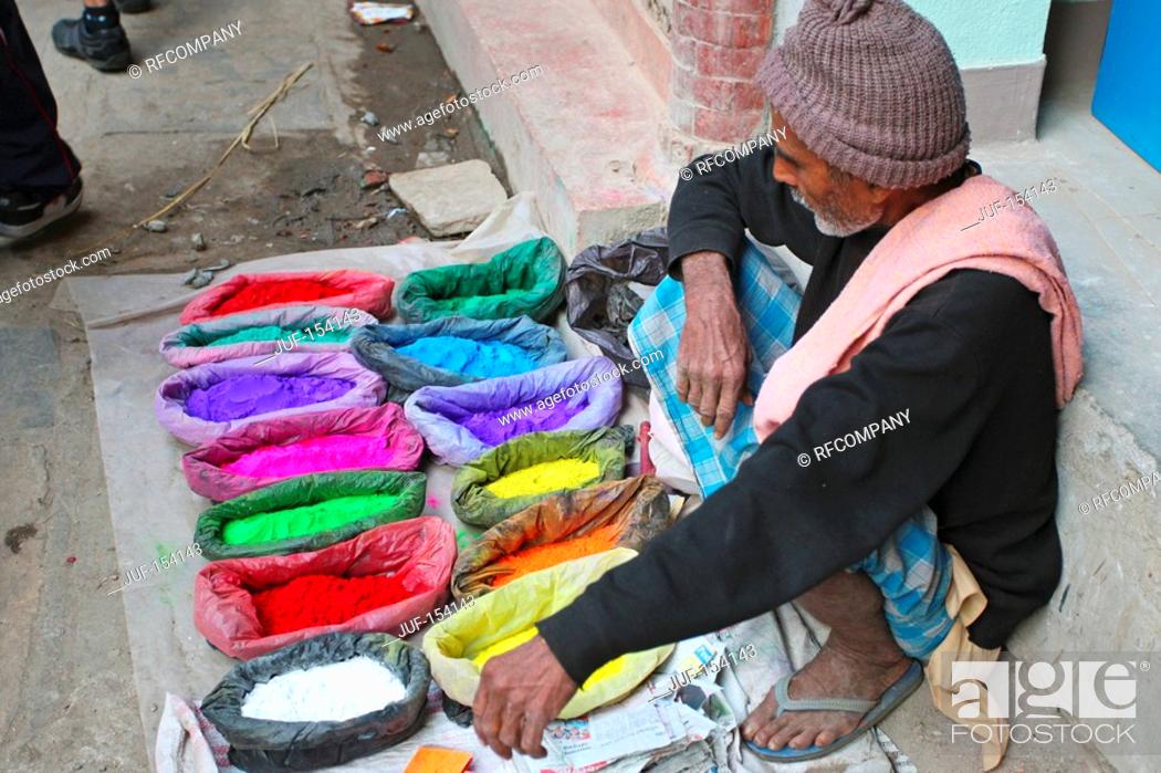 Stock Photo: Kathmandu - street hawker selling colours.