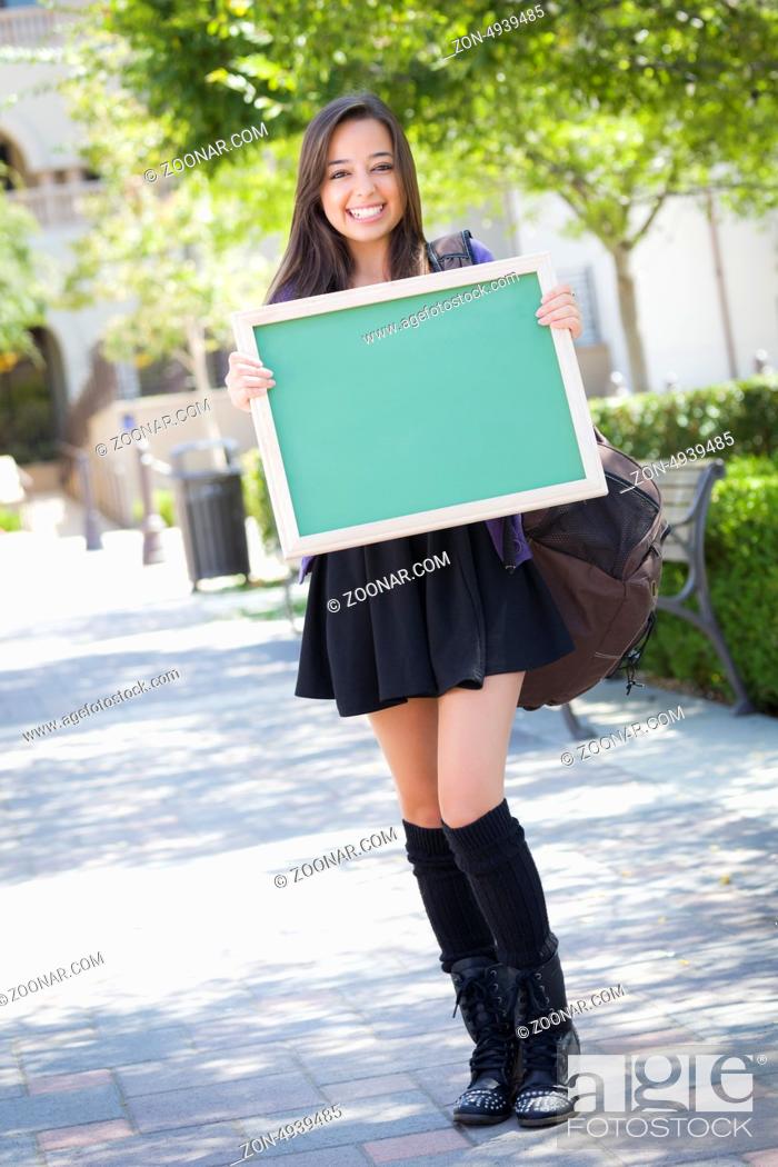 Stock Photo: Portrait of An Attractive Excited Mixed Race Female Student Holding Blank Chalkboard and Carrying Backpack on School Campus.