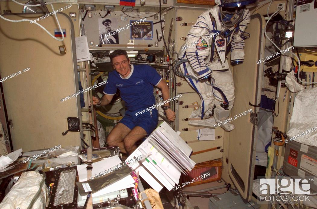 Stock Photo: Astronaut William S. (Bill) McArthur, Expedition 12 commander and NASA space station science officer, floats in the Zvezda Service Module of the International.