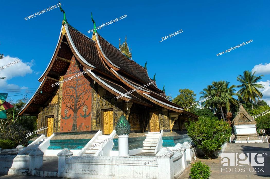 Stock Photo: View of the Tree of Life mosaic on the sims back wall of Wat Xieng Thong in the UNESCO world heritage town of Luang Prabang in Central Laos.