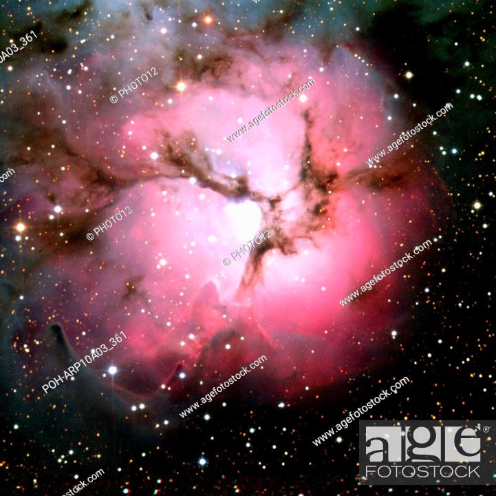 Stock Photo: Spitzer Space Telescope composite visible-light and infrared views of the glowing Trifid Nebula, a giant star-forming cloud of gas and dust located in the.